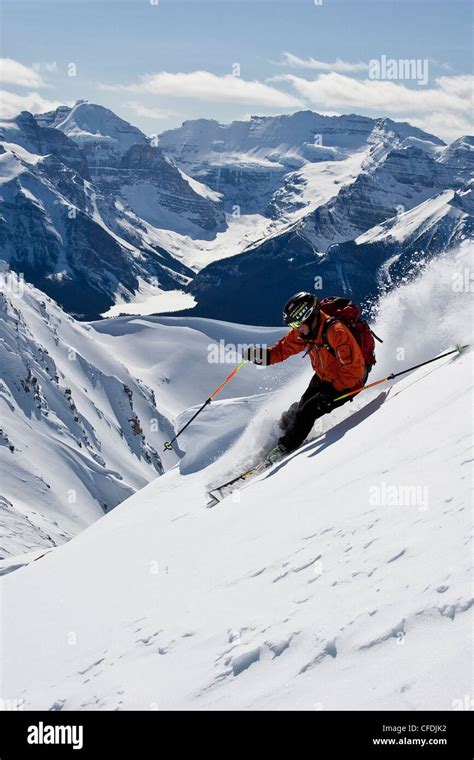 Young man skiing powder at Lake Louise Ski Area, Banff National Park, Alberta, Canada Stock ...