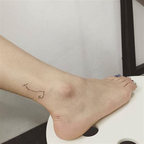 Scorpius constellation tattoo on the ankle.