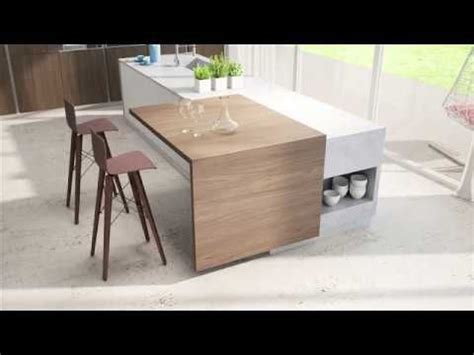 an image of a modern kitchen setting with bar stools and counter top in the middle