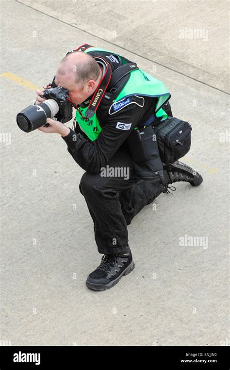 Professional photographer trackside motorsport Stock Photo - Alamy