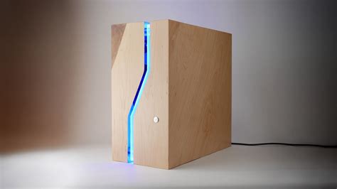 a wooden box with a blue light coming out of the side and inside, on a ...