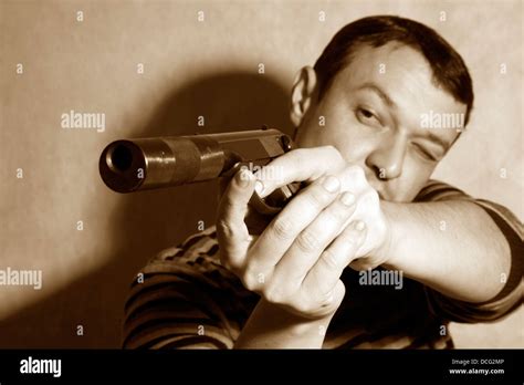 man with a pistol Stock Photo - Alamy