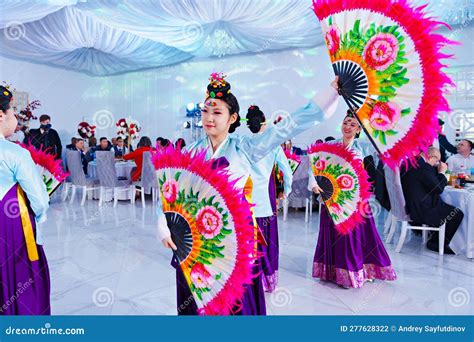 Dancers in National Costumes Dance a Traditional Korean Dance with a ...