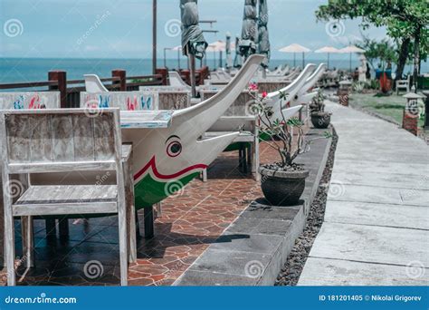 Treet Cafe with Umbrellas and Tables in Sea Dolphin Lead Stock Image - Image of dinner, cafe ...