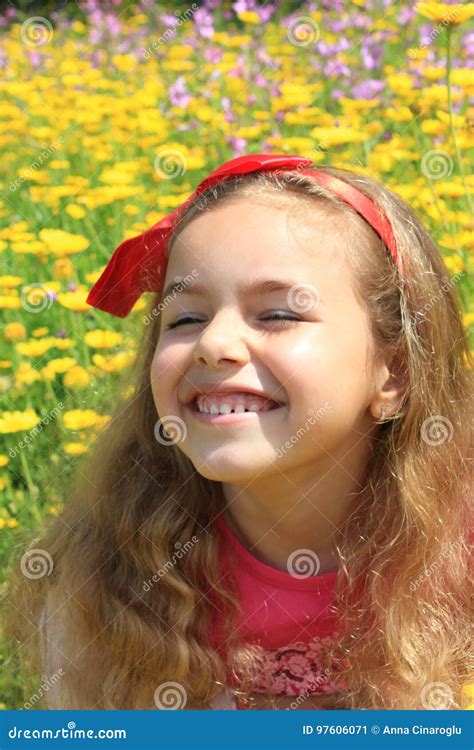 Happy Girl Smiling in a Yellow Flowers Garden Stock Image - Image of life, cute: 97606071