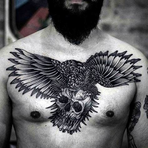 Flying eagle with human skull in clutches black and white detailed chest tattoo - Tattooimages.biz