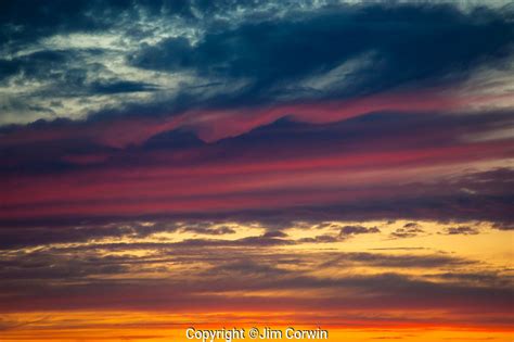 Multicolored Stratocumulus clouds at sunset | Jim Corwin Photographer