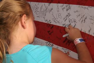 Signing Flag | Elysia Rodgers writes her name under her moth… | Flickr