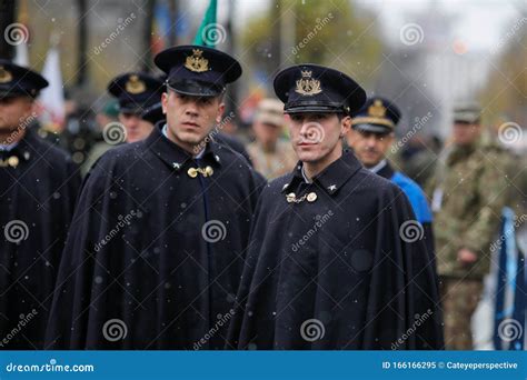 Soldiers In Ceremonial Blue Uniforms With Rifles Stand Quietly In Front Of The Serbian ...