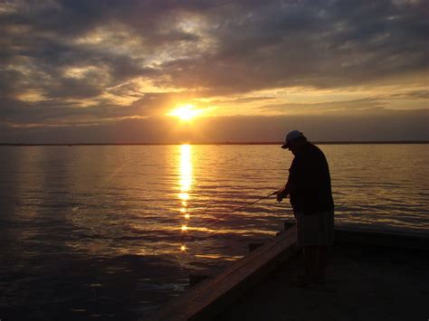 Man fishing at sunset. | Smithsonian Photo Contest | Smithsonian Magazine