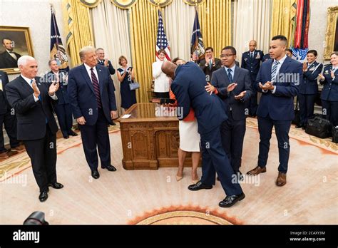 U.S. Air Force General Charles Q. Brown, embraces his wife Sharene ...