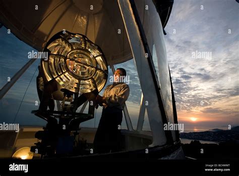 Lighthouse man controls the Fresnel glass in the lighthouse of Monte Orlando Gaeta Stock Photo ...