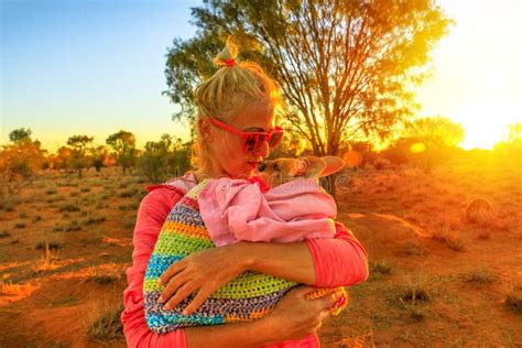 Woman kissing kangaroo stock photo. Image of center - 158508556