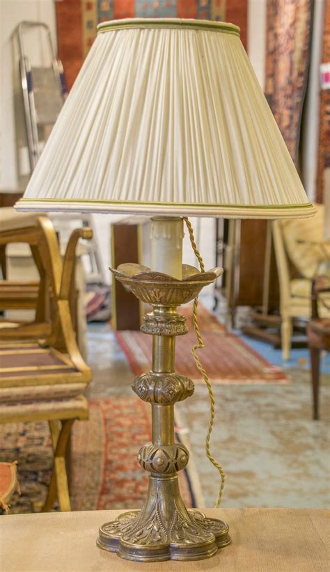 LAMP BASES, a pair, gilt metal with cast decoration, 62cm H overall ...