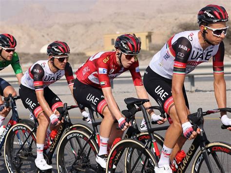 Photos: UAE Team Emirates' Tadej Pogacar holds on to lead after UAE ...