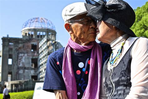 Traveling Photographer Captures Couples Kissing in Public Around the World