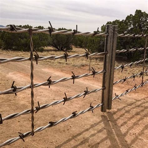 Custom designed barbed wire driveway gate | Metal driveway gates, Farm gate, Farm gate entrance ...