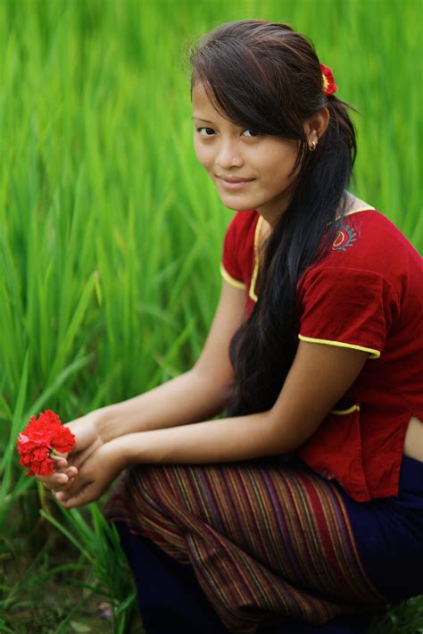 Thaman Nepali girl with flower, Chitwan National Parc, Ter… | Flickr