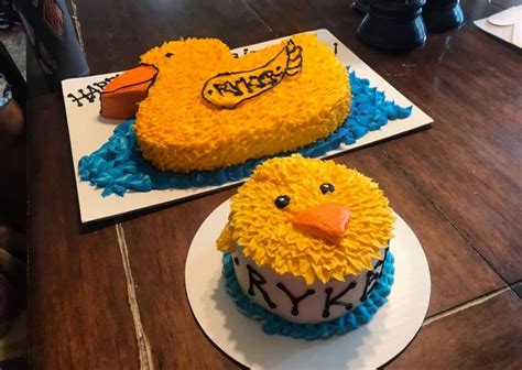 two cakes decorated to look like rubber ducks