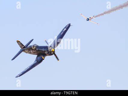 A Vought F4U Corsair fighter and Japanese Zero recreate an aerial ...