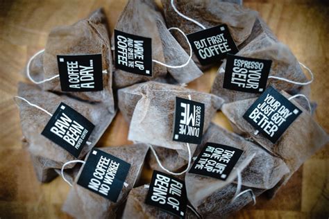 several bags of coffee sitting on top of a wooden table