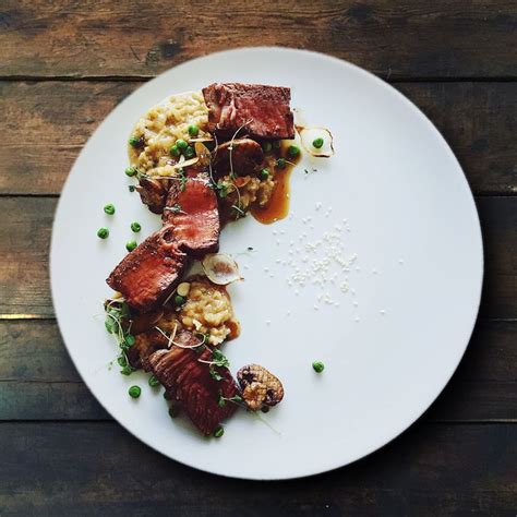 Wild mushroom risotto with seared fillet mignon and flavoured beef ...