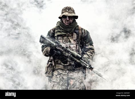 Brutal commando veteran army soldier armed sniper rifle Stock Photo - Alamy