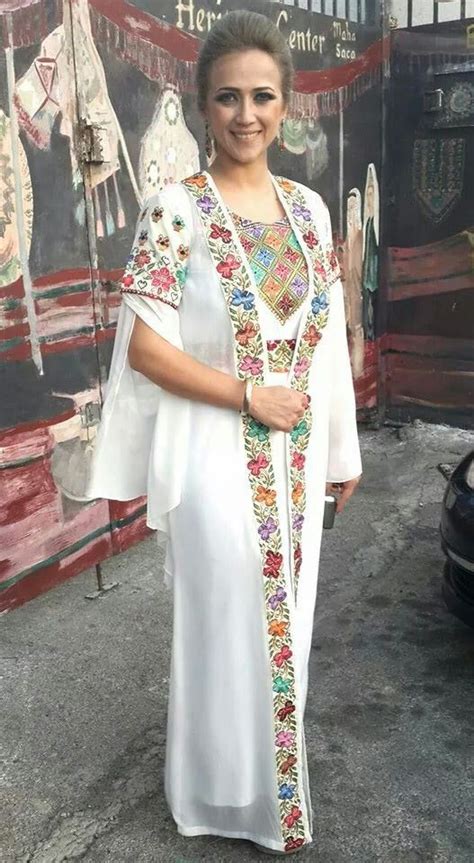 Dalal Abu Amneh looking fabulous in a Modern palestinian toub.