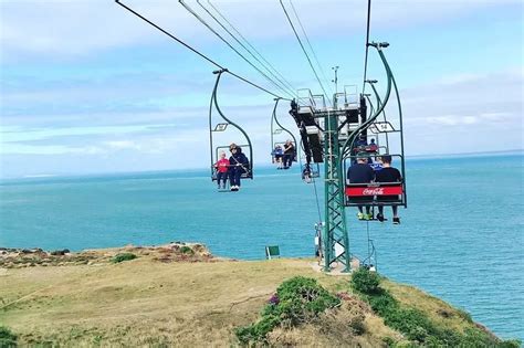 The beautiful beach 3 hours from London visitors take a 'terrifying' chairlift down to get to ...