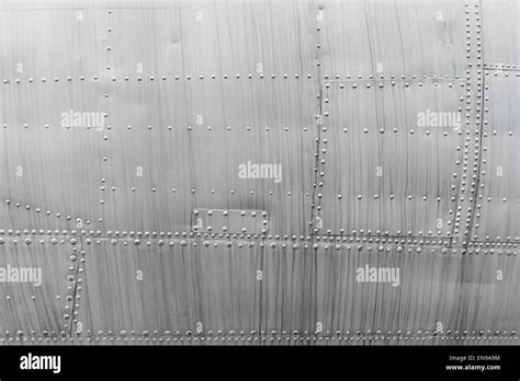 Duralumin sheets with rivets. A fragment of the old airplane close-up Stock Photo - Alamy