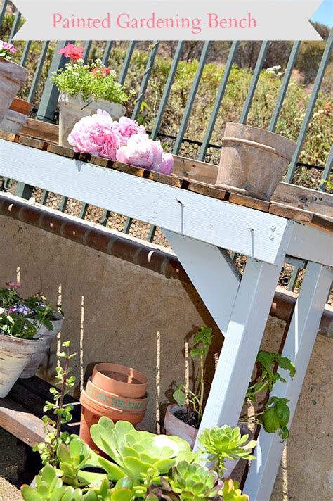 Painted garden bench with dark stain and blue paint.