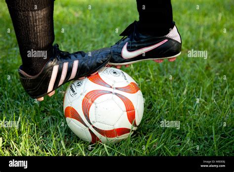 Two Feet on Soccer Ball, Close-up Stock Photo - Alamy