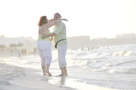 happy seniors couple on beach 12641919 Stock Photo at Vecteezy