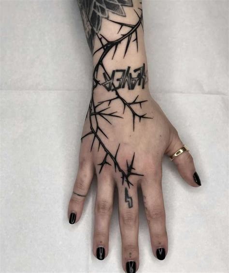 Lightning thorn tattoo by Tine DeFiore inked on the right hand | Thorn tattoo, Hand tattoos ...