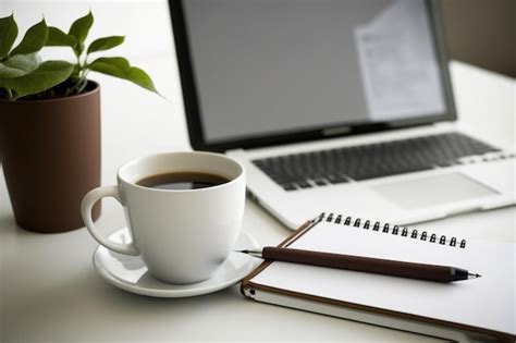 Premium AI Image | Coffee cup and laptop on white desk