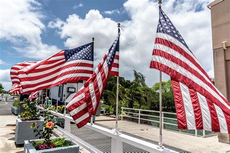 American Flags Flying in the Wind Photograph by Brian Johnson - Pixels