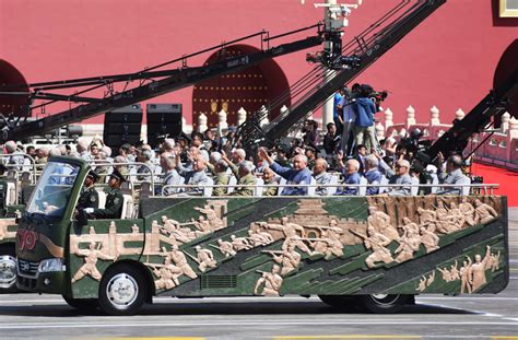 China holds massive military parade, to cut troop levels by 300,000