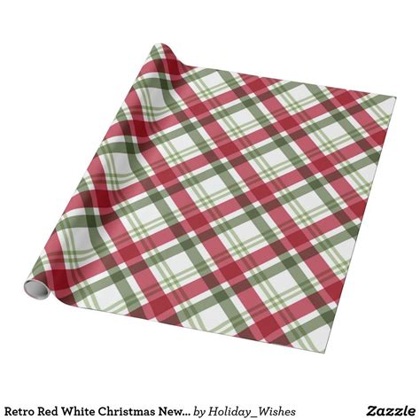 a red and green plaid christmas wrapping paper on a white background ...