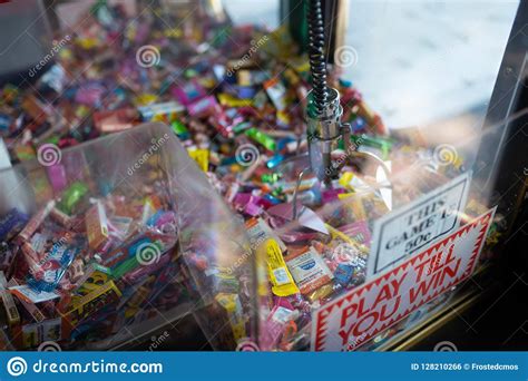 Claw Machine with Candy Inside Editorial Photo - Image of reads ...