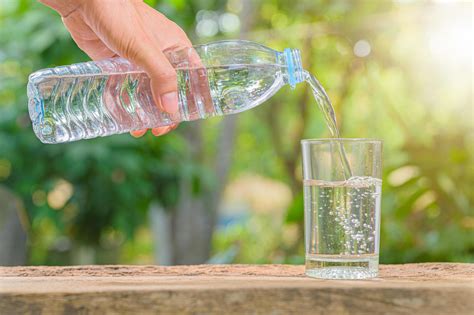 Bottle of drinking water and glass with natural background 2081312 ...