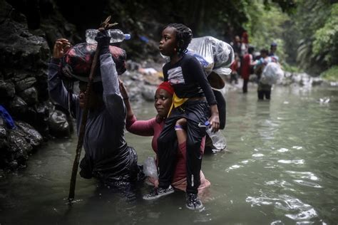 Migrants crossing dense Darien jungle at…