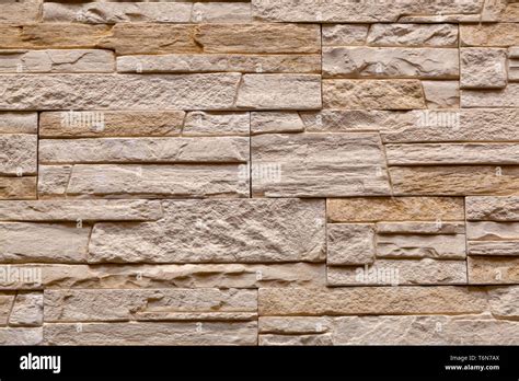 Background of brown stone wall made with blocks . Pattern of slate wall ...