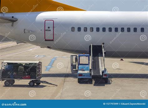 Unloading Bags, Luggage and To/from an Airplane Stock Image - Image of aircraft, plane: 157797099