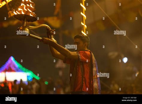 Ganga aarti, Portrait of an young priest performing river ganges ...