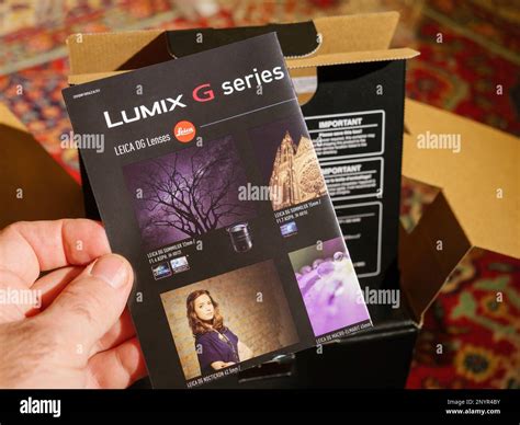 Paris, France - Dec 2, 2022: New Panasonic Lumix G by leica series lenses flyer during unboxing ...