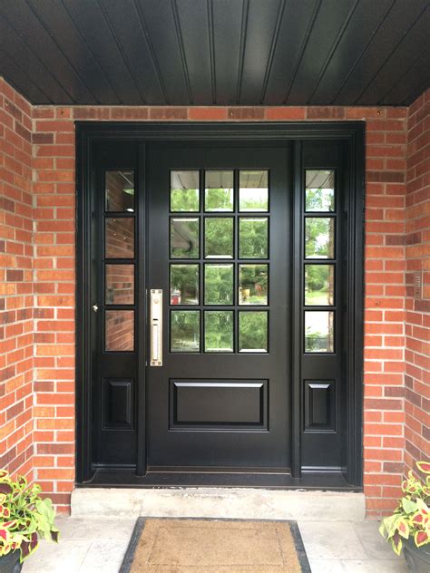 This richly black stained solid mahogany #Amberwood custom #door with 12 divided lights, looks ...