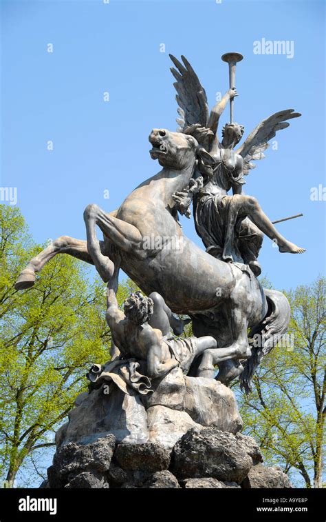 Statue angel on horse baroque fountain in the garden at Herrenchiemsee palace Herreninsel ...