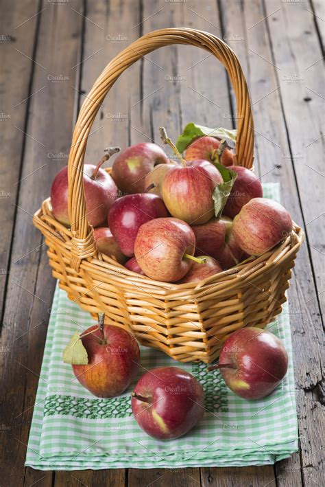 Basket with apples on a wooden table containing apple, basket, and ...