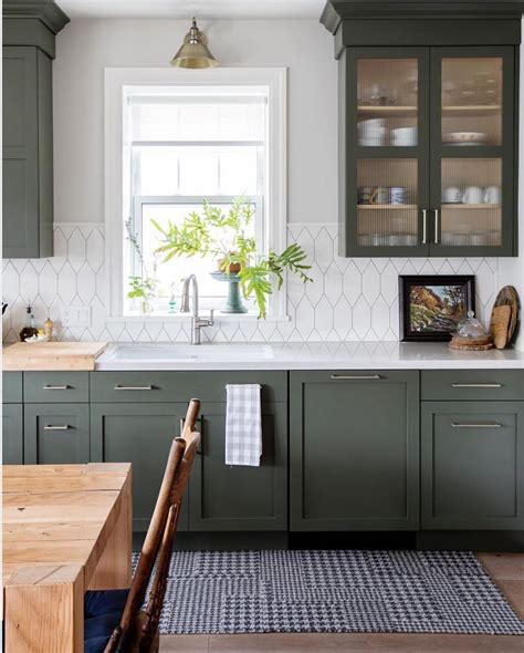 Style Me Pretty Living on Instagram: “Something about deep green kitchens bring summer feels...i ...