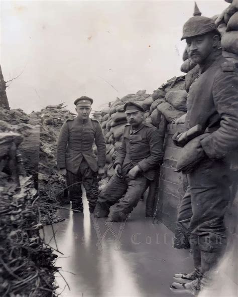 German soldiers posing for a photograph in a flooded trench, ca. 1915 ...